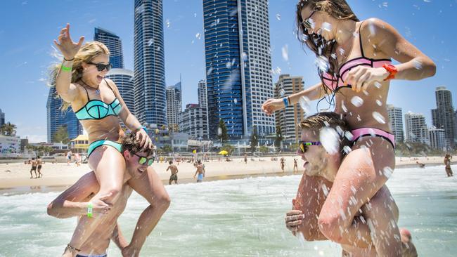 Schoolies teens L-R Chloe Johnstone, Rob Huelitt, Jemma Dorward and Brodie Healy all 18 from Maffra in Victoria's Gippsland, wash their hangovers away at Surfers Paradise, Gold Coast. Picture: Jason Edwards