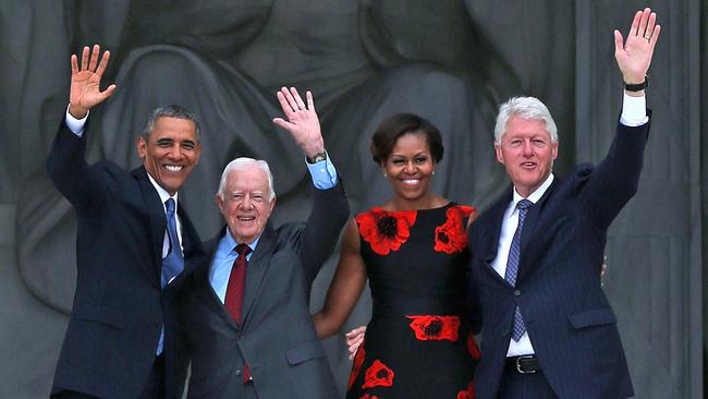 Then US president Barack Obama with Carter, Michelle Obama and former US president Bill Clinton in 2013. Picture: Getty Images