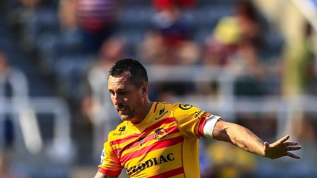 NEWCASTLE UPON TYNE, ENGLAND - JULY 10: Mitchell Pearce of Catalan Dragons plays a grubber kick during the Betfred Super LeagueÃ&#130;Â Magic Weekend match between Catalans Dragons and Warrington Wolves at St James' Park on July 10, 2022 in Newcastle upon Tyne, England. (Photo by Lee Parker - CameraSport via Getty Images)