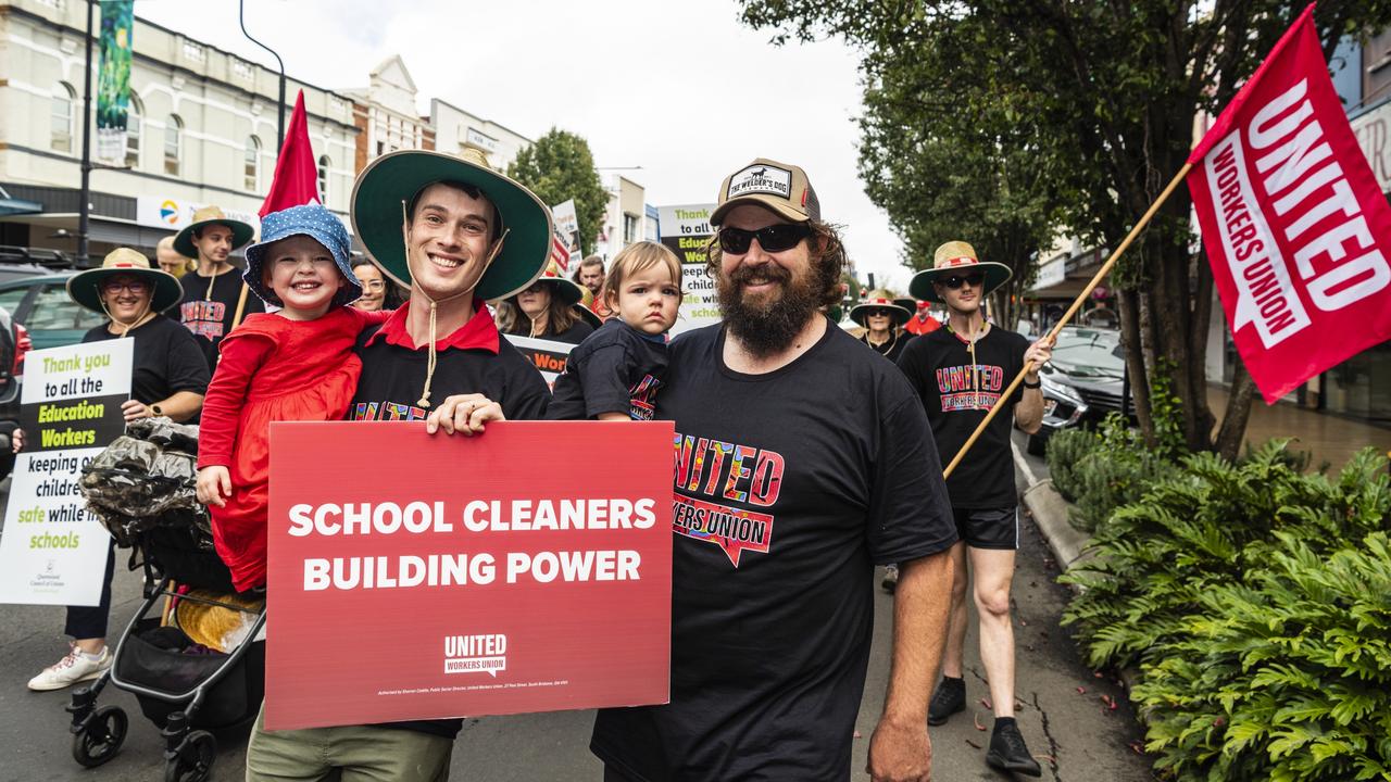 Supporting the United Worekers Union are Tom Keighran (left) holding Mili and Zac Burton holding Posie at the Labour Day 2022 Toowoomba march, Saturday, April 30, 2022. Picture: Kevin Farmer