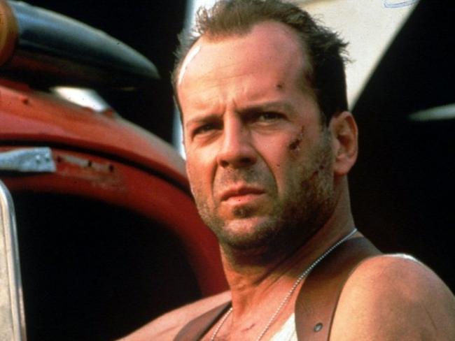 Bruce Willis rocking hair and a singlet in Die Hard. Picture: Supplied