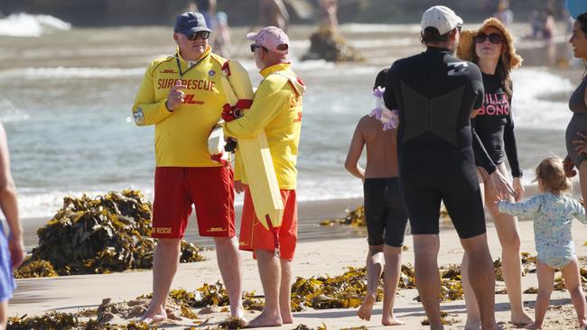 Lifeguards keep an eye out over Freshwater Beach on the first day of its reopening. Picture: Tim Pascoe