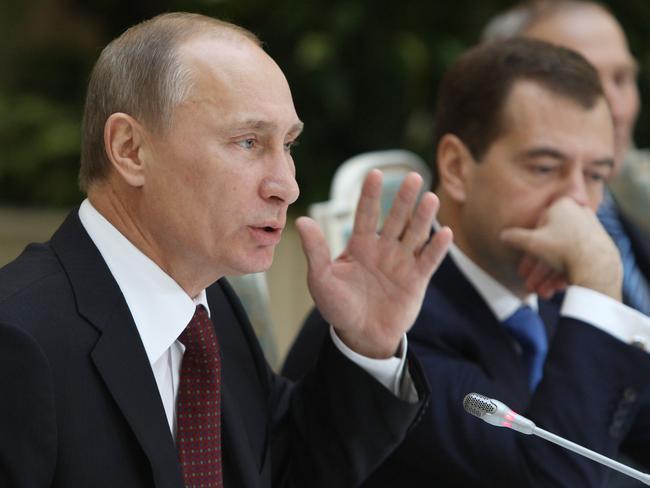 Russia's Prime Minister Dmitry Medvedev (R) and President Vladimir Putin. Picture: AFP