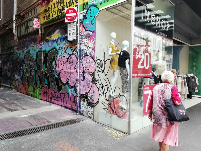 Graffiti on Inshop fashion in Bourke St Mall.