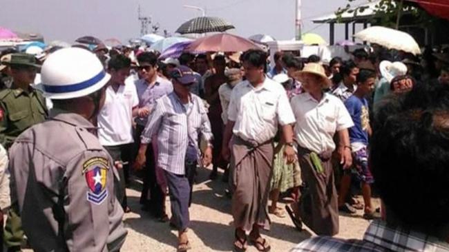 Officials arrive near Kyauk Phyu port, Burma near where a ferry capsized after being slammed by huge waves. Picture: AP Photo/DVB