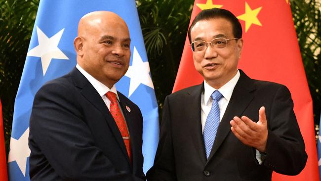 Micronesia's outgoing president David Panuelo (L) with China's Premier Li Keqiang at the Great Hall of the People in Beijing in 2019.