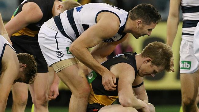 Harry Taylor comforts fellow milestone man Jack Riewoldt. Picture: Wayne Ludbey