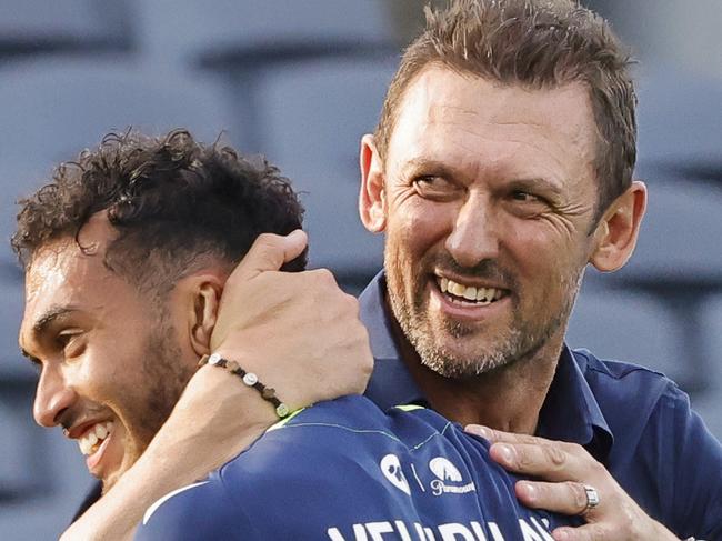 SYDNEY, AUSTRALIA - DECEMBER 11: Victory coach Tony Popovic hugs Nishan Velupillay of the Victory after their win during the round seven A-League Men's match between Macarthur FC and Melbourne Victory at Campbelltown Stadium, on December 11, 2022, in Sydney, Australia. (Photo by Jenny Evans/Getty Images)