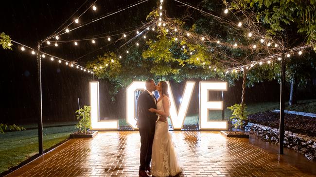 Katelyn Alexander and Avilash Singh didn’t let the rain dampen their spirits on their wedding day. Picture: Salt Studios