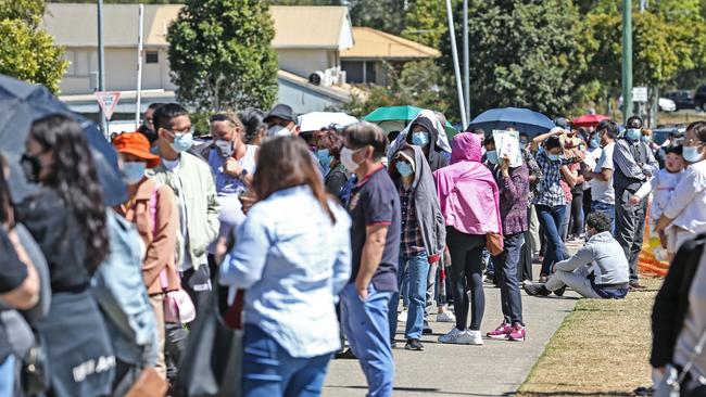 People line up out the front of the Logan Entertainment Centre to receive their COVID-19 vaccination. Picture: Zak Simmonds