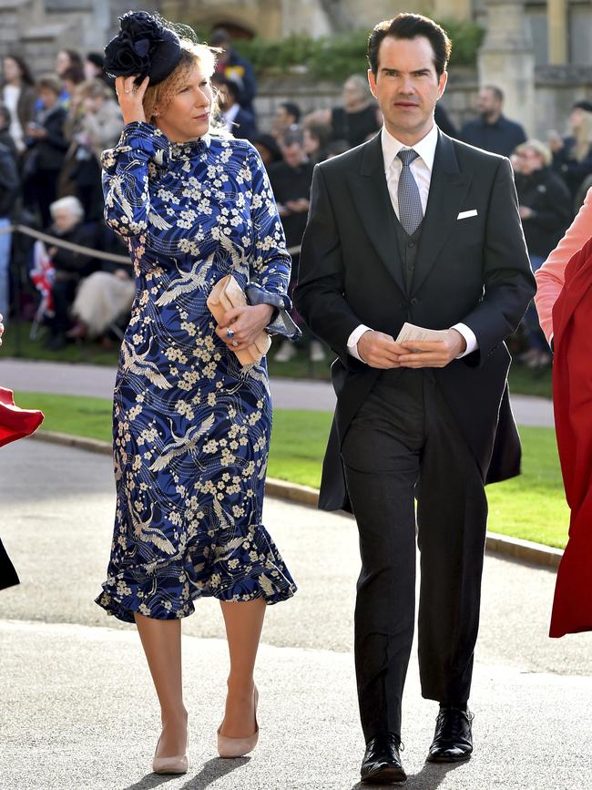 Carr with his book editor partner Karoline Copping, who is wearing a gorgeous blue, black and white dress. Picture: AP