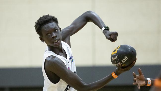 Hok Marial gets a handball away. Picture: Riley Lockett/AFL Photos