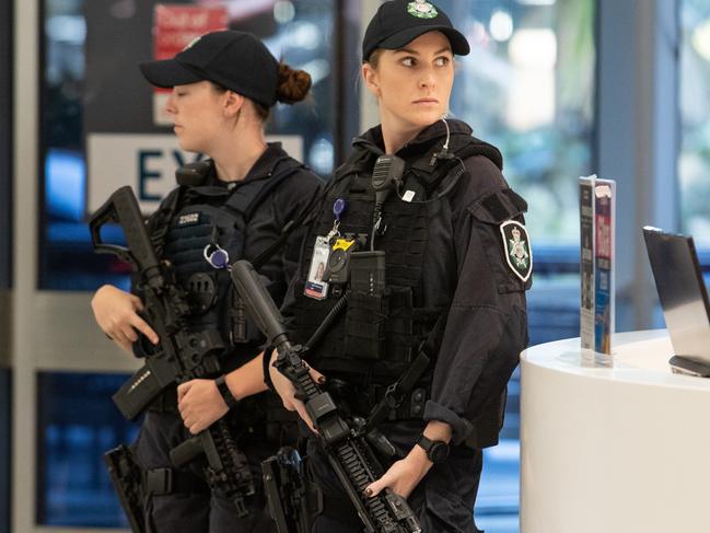 AFP uniformed officers at Sydney Airport where the first of four Islamic State wives and 13 children arrived on a flight from Dubai. Picture: Julian Andrews