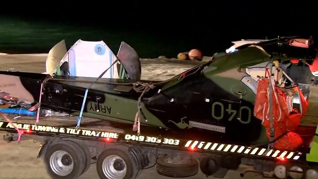 Debris from the crashed MRH-90 Taipan helicopter killing all four onboard during Exercise Talisman Sabre are unloaded from a barge in Airlie Beach, Queensland Picture: 9News