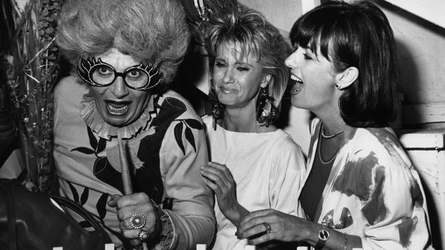 Barry Humphries, left, Olivia Newton-John and Pat Carroll Farrar in Beverly Hills, California, in 1983. Picture: Getty Images