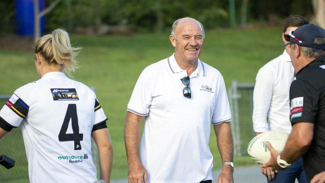 Rugby league legend Wally Lewis at the women's rugby game between Souths Logan and Wests to watch his daughter Jamie-Lee Lewis. He shares a joke with coach Rob Brough as his daughter passes. (AAP Image/Richard Walker)