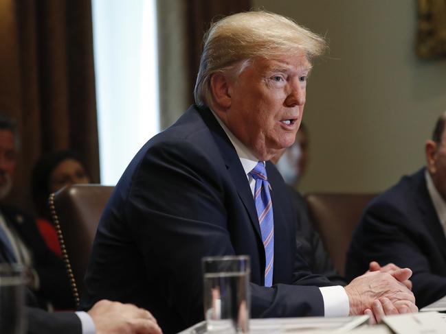 President Donald Trump speaks during his meeting with members of his cabinet in Cabinet Room of the White House in Washington, Wednesday, July 18, 2018. Also at the meeting is Commerce Secretary Wilbur Ross, far right. (AP Photo/Pablo Martinez Monsivais)
