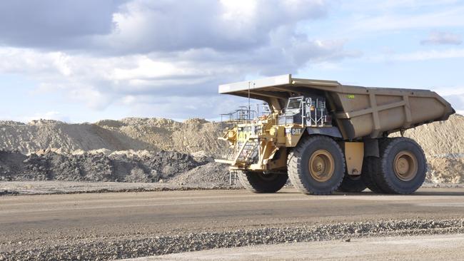 A dump truck heads out of a pit at New Acland coal mine. Photo: Stuart Cumming / The Chronicle