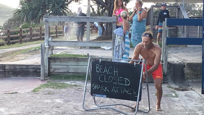 Signs are erected closing beaches at Byron Bay yesterday.