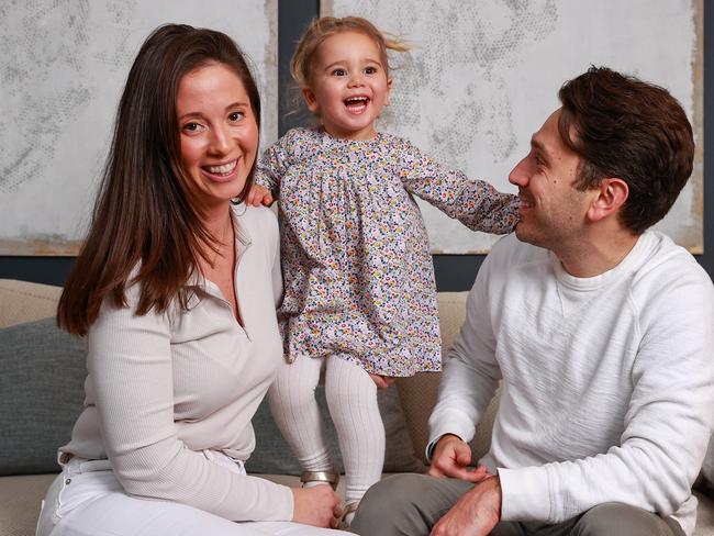 Daily Telegraph. 05, July, 2022.**For SMARTdaily cover story about investing for children**Rhodie and Alex Bedwani, with their daughter, Audrey, 2, at home, in Darlinghurst, today. Picture: Justin Lloyd.