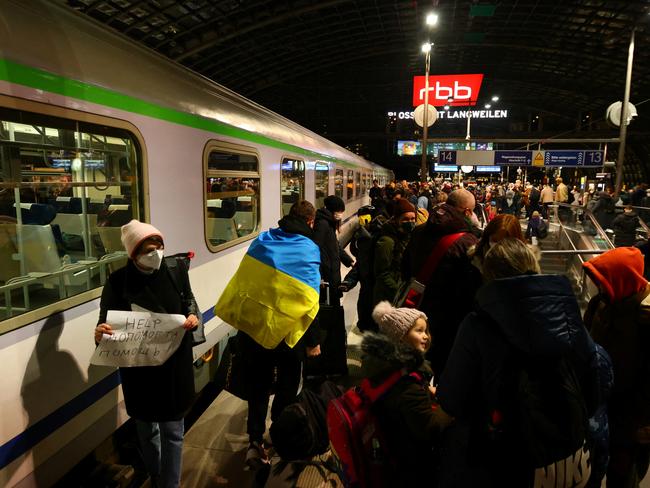 Volunteers offer help to refugees after a train from Poland arrived at Berlin's central train station, following Russia's invasion of Ukraine. Picture: Reuters