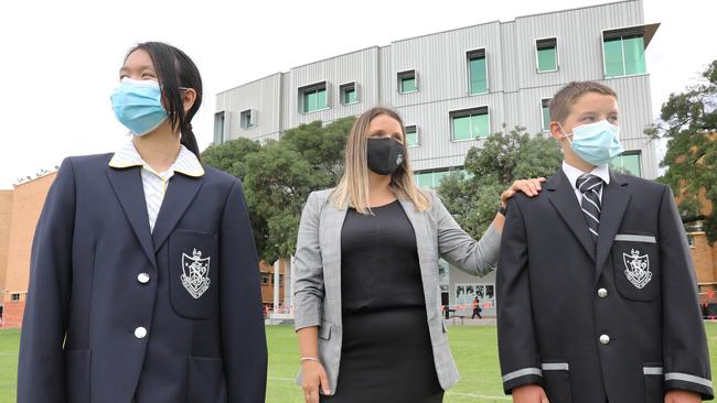 Adelaide High School students Harley Clark, 12, and Efia Pan, 12, with Year 7 Learning and Engagement Leader, Jacinta Coombe. Picture Dean Martin