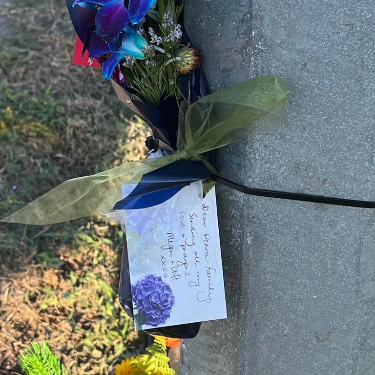 Flowers laid by loved ones at the sight of the crash that killed 22-year-old Slater Pearce on April 7, 2025.