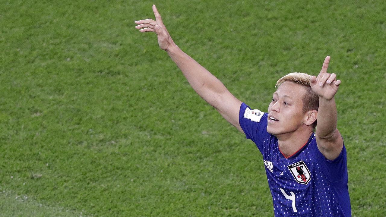 Japan's Keisuke Honda celebrates after scoring.