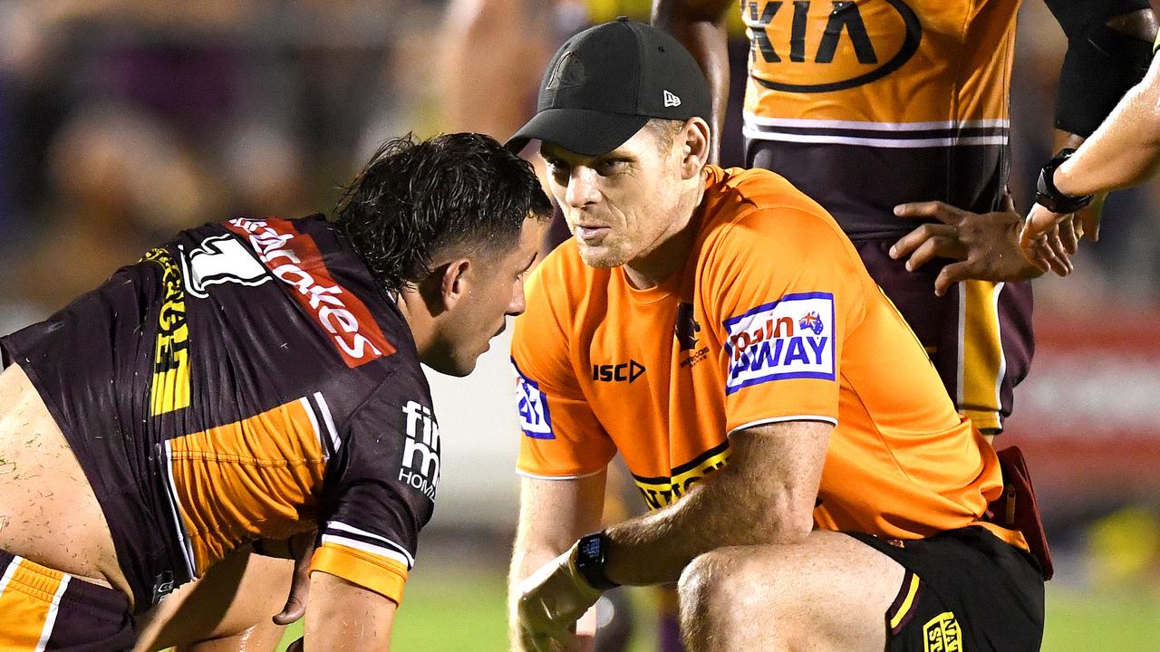 Jack Bird of the Broncos is seen to by a trainer.