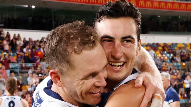 Sam Simpson and Joel Selwood celebrate Geelong’s preliminary final victory.