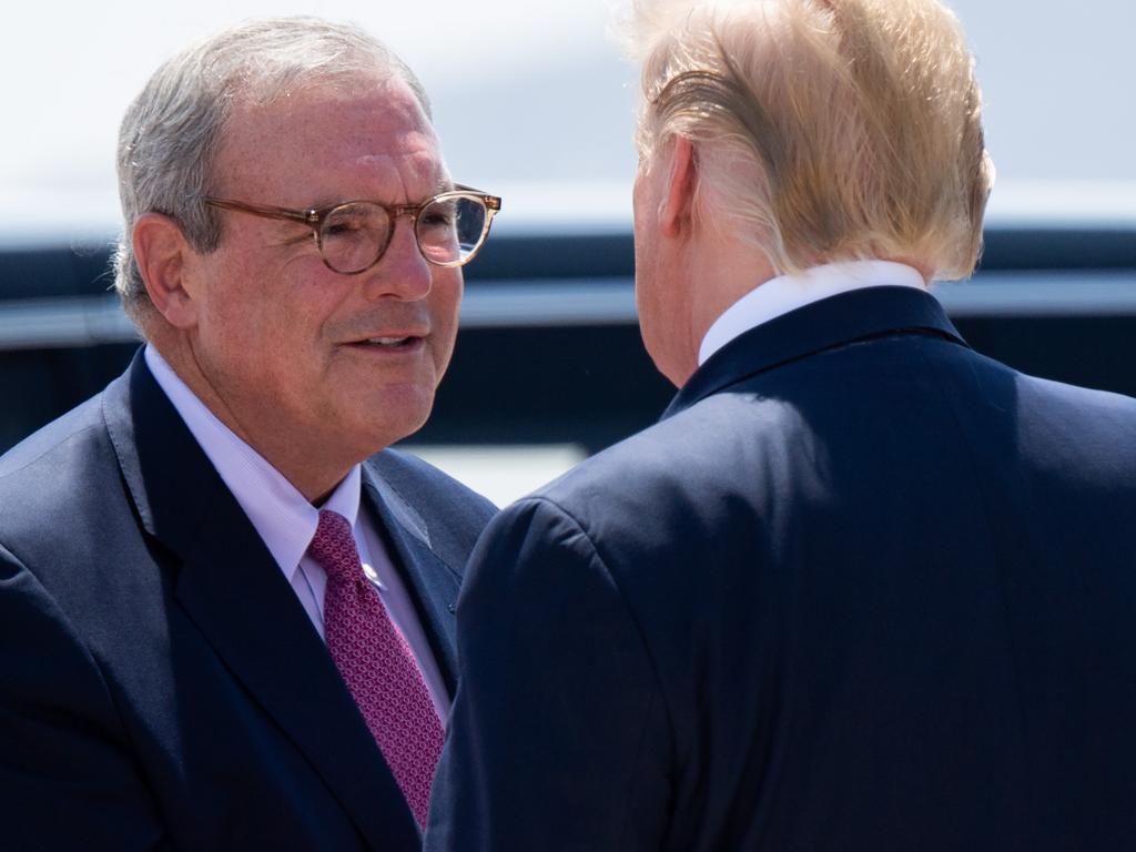 Trump greets El Paso’s Republican Mayor Dee Margo (L) as he disembarks from Air Force One upon arrival at El Paso International Airport. Picture: AP