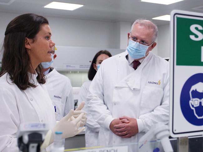 SYDNEY, AUSTRALIA - AUGUST 19: Prime Minister Scott Morrison meets with team member Savannah Alegre, Specialist Team Lead of the Microbiology Laboratory at AstraZeneca on August 19, 2020 in Sydney, Australia. The Australian government has announced an agreement with the British pharmaceutical giant AstraZeneca to secure at least 25 million doses of a COVID-19 vaccine if it passes clinical trials.  The University of Oxford COVID-19 vaccine is currently in phase-three testing. If the vaccine proves to be successful, Australia will manufacture and supply vaccines and will be made available for free. The project could deliver the first vaccines by the end of this year or by early 2021. (Photo by Lisa Maree Williams - Pool/Getty Images) *** BESTPIX ***