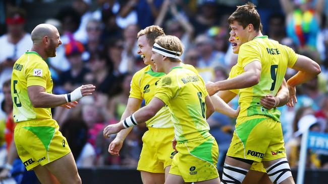 Tim Anstee celebrates his three tries in less than four minutes as Australia rolled over Scotland.
