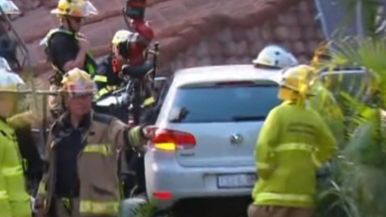 Car ploughs into roof of Brisbane home, woman trapped