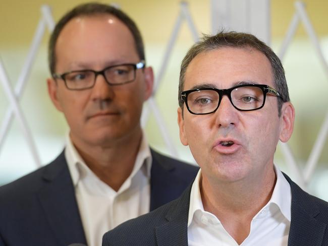 South Australian Liberal leader Steven Marshall (right) and Liberal frontbencher Corey Wingard speak during a press conference at Marion Shopping Centre in Marion, Monday, March 12, 2018. Opposition Leader Steven Marshall says he'll move swiftly to deregulate shop trading hours in South Australia if the Liberals win Saturday's election. (AAP Image/Tracey Nearmy) NO ARCHIVING