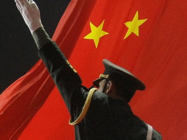 Chinese military soldiers salute as the Chinese flag is raised during the Opening Ceremony of the 2008 Beijing Olympic Games in Beijing, China 08/08/2008.