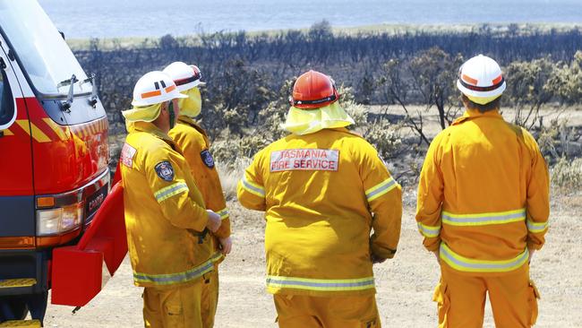 Firefighters surveying the damage in the Central Highlands. Picture: MATT THOMPSON