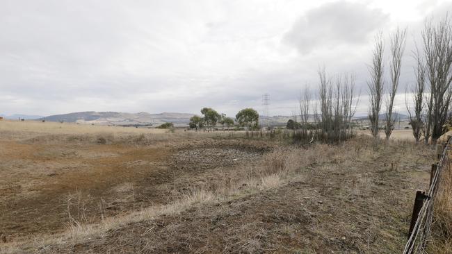 Weather forecasts for July and September predict dry conditions for farmers this year.  Pictured at Orielton, Tasmania is this empty dam and dry paddocks.PIC: MATT THOMPSON