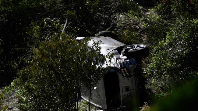 The vehicle driven by golfer Tiger Woods lies on its side in Rancho Palos Verdes, California, on February 23, 2021, after a rollover accident. Photo: AFP