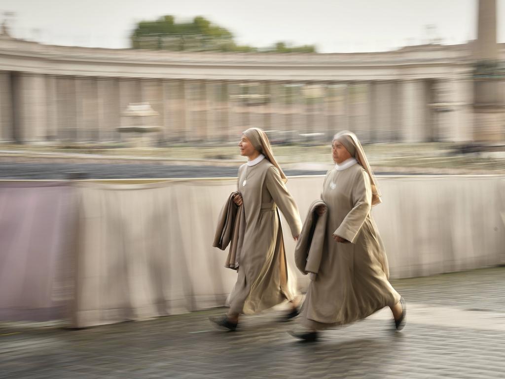 Nuns arrive in St. Peter's Square as they await the arrival of the body of Pope Francis. Picture: AP