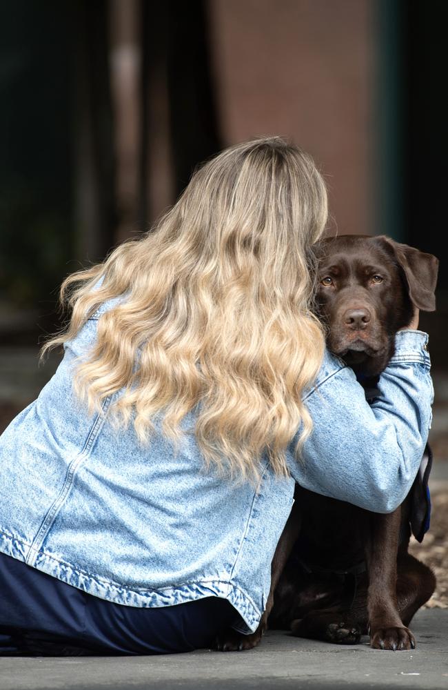 Grace pictured with court support dog Lucy. Picture: Nicki Connolly/news.com.au