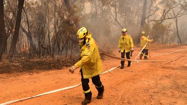 ‘Worst possible circumstances’: firefighters continue the battle to contain the Gospers Mountain fire in the Blue Mountains near Sydney. Picture: AAP