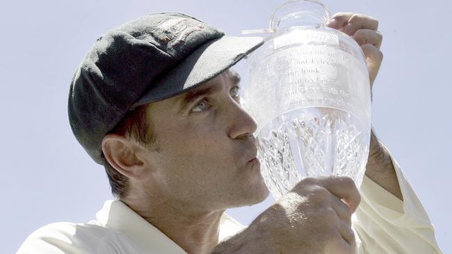 Langer kisses the Ashes trophy in 2007. (AP Photo/Rob Griffith)