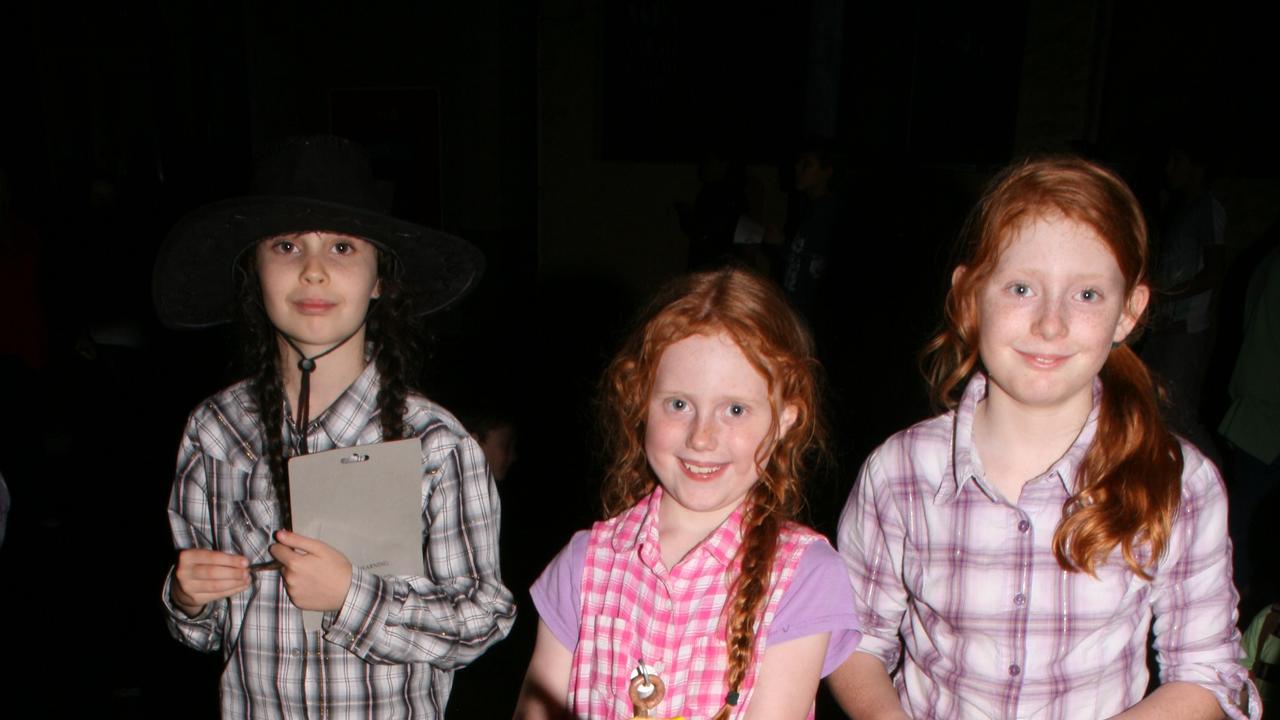 <p>Kiarra Watson and Hayleigh and Rachel Anderson win a prize on the lucky ducks at the Warwick Rodeo Mardi Gras. Photo Deanna Millard / Daily News</p>