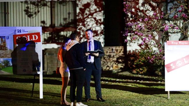 Police speak to witnesses outside the Redbank Rd house in Northmead where three teens were stabbed at a birthday party in August 2019. Picture: Steve Tyson