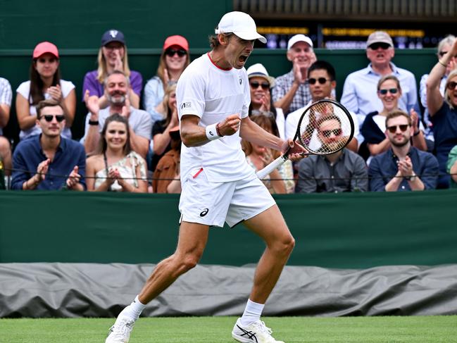 LONDON, ENGLAND - JULY 06: Alex De Minaur of Australia celebrates winning match point against Kimmer Coppejans of Begium in the Men's Singles first round match during day four of The Championships Wimbledon 2023 at All England Lawn Tennis and Croquet Club on July 06, 2023 in London, England. (Photo by Shaun Botterill/Getty Images)