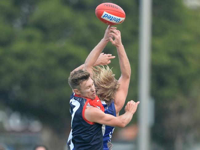 Tim Lanyon and Liam Kinsella compete for the ball earlier this year.