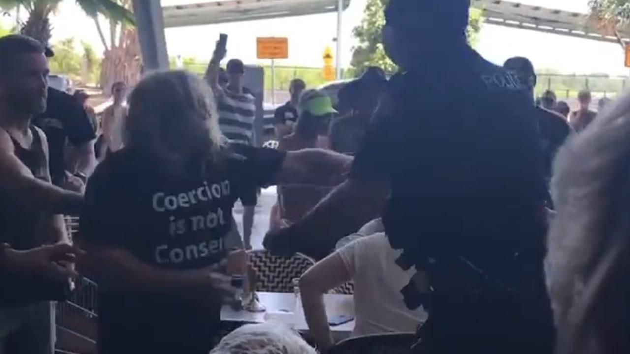 Mackay police arrested three men after an anti vaccination rally at Caneland Central allegedly turned violent.