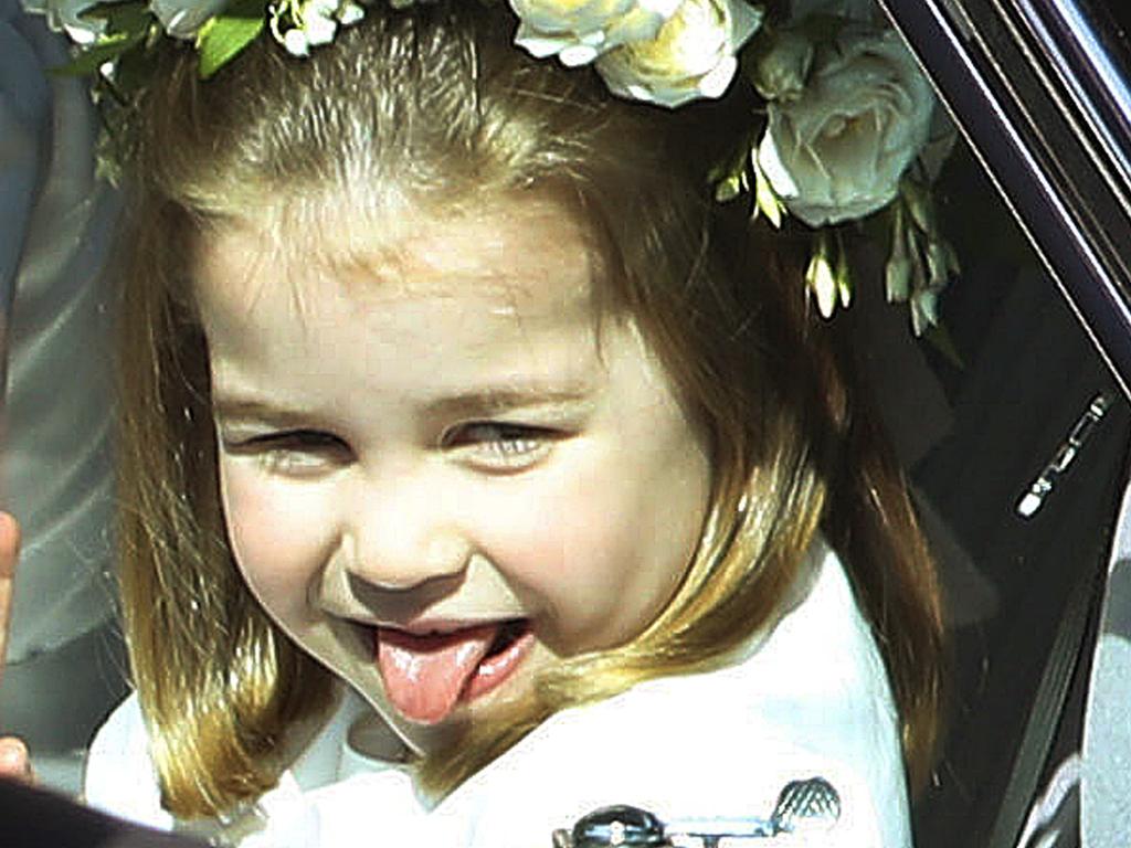Princess Charlotte sticks out her tongue as she rides in a car to the wedding ceremony of Prince Harry and Meghan Markle at St. George's Chapel in Windsor Castle in Windsor, near London, England, Saturday, May 19, 2018. Picture: Andrew Milligan/AP