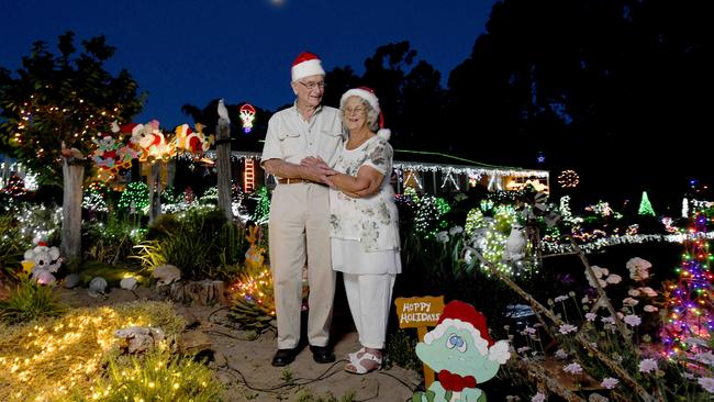 Peg and Bill Chartres at their home in Lobethal with hundreds of Christmas lights and displays in their front yard. Picture: Naomi Jellicoe